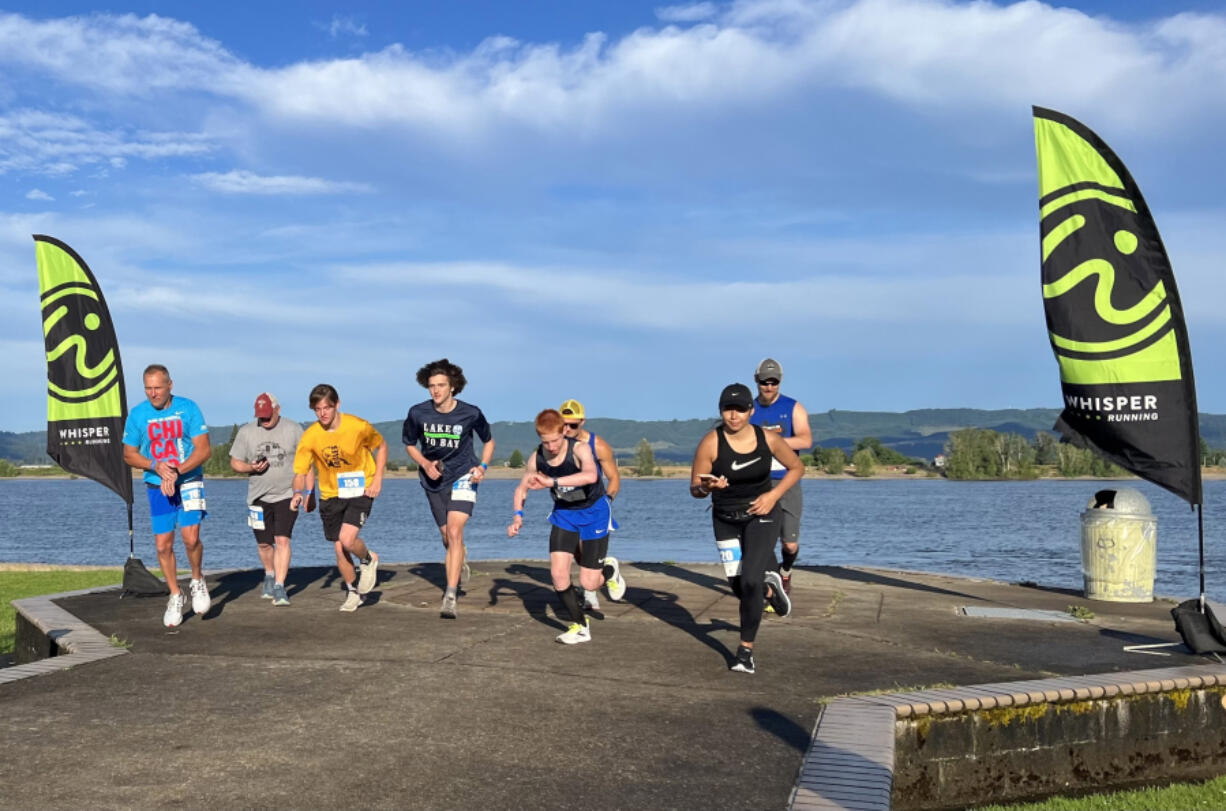 A wave of participants in the 2022 Lake to Bay start the first leg of the relay at Frenchman's Bar Regional Park along the Columbia River in Vancouver.