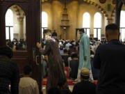 Worshippers gather for Jummah prayers at Darussalam mosque in Lombard on April 14, 2023. (E.