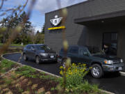 Barista Karlie Ramirez serves coffee to customers at the new Motor Moka in Vancouver on Tuesday morning. Motor Moka started decades ago in Portland as a drive-thru coffee chain before drive-thru coffee shops were all the rage.