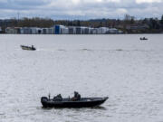 Anglers gather on the Columbia River on Tuesday, as seen from Waterfront Park. As of April 13, spring chinook runs are below the 10-year average, 637 compared to 2,210 on the same date.