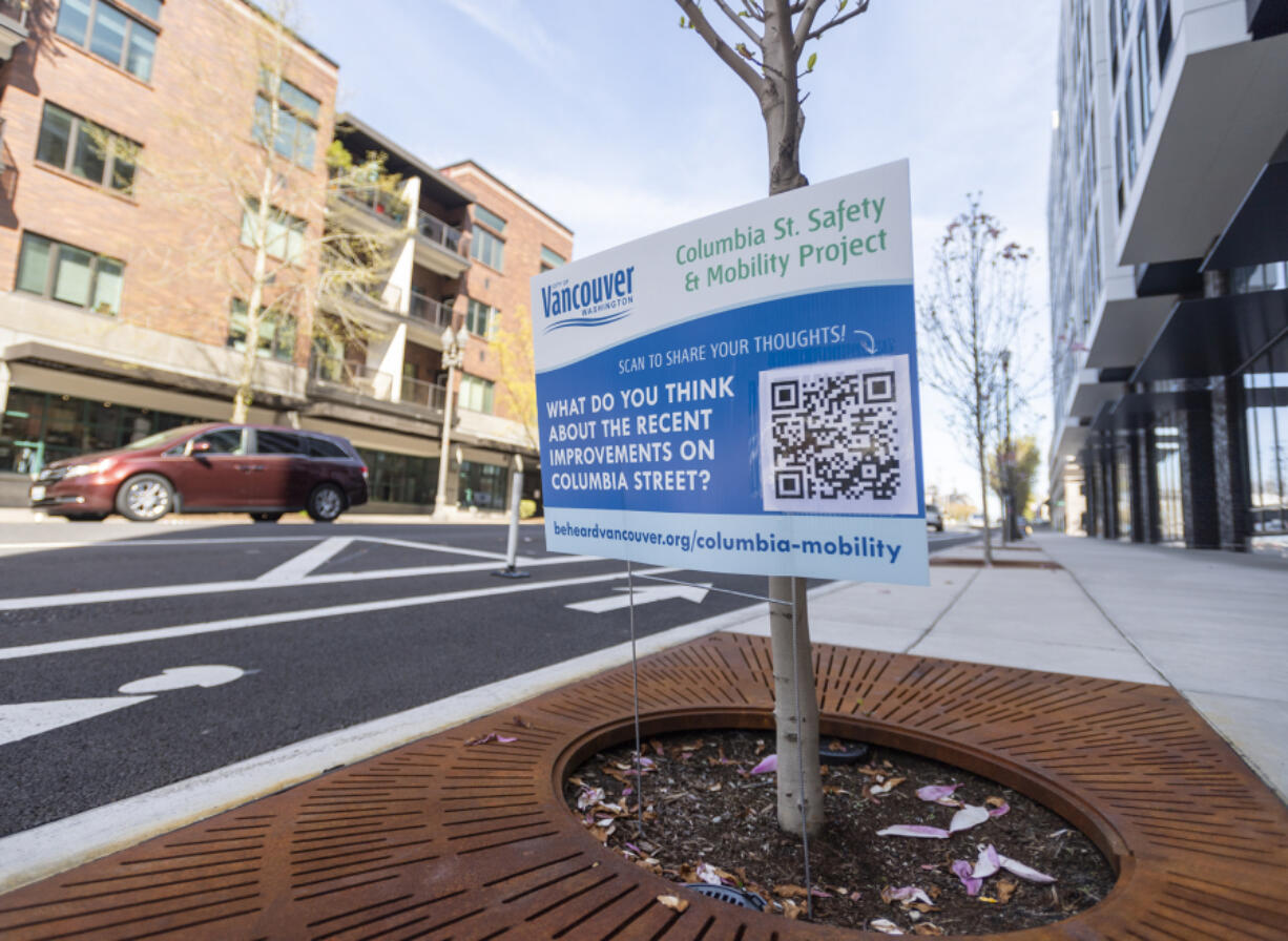 A sign along Columbia Street asks for public input on recent projects in downtown Vancouver. Other signs seek greater public involvement in the city's Fourth Plain for All program.