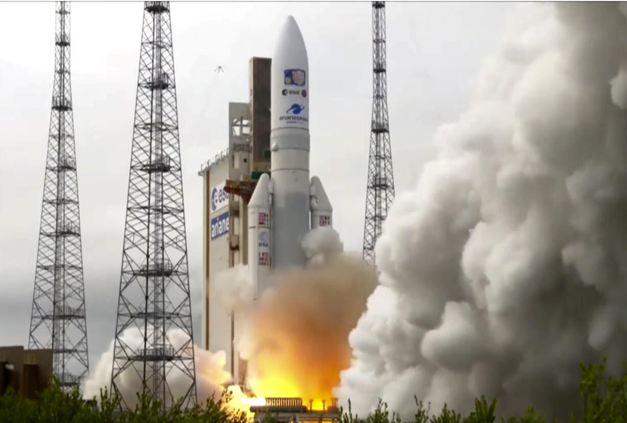 In this image provided by the European Space Agency, an Ariane rocket carrying the robotic explorer Juice takes off from Europe's Spaceport in French Guiana, Friday, April 14, 2023. European spacecraft has blasted off on a quest to explore Jupiter and three of its ice-encrusted moons. Dubbed Juice, the robotic explorer set off on an eight-year journey Friday from French Guiana in South America, launching atop an Ariane rocket.