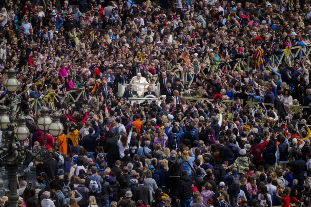 Pope Francis leaves after celebrating the Palm Sunday's mass in St. Peter's Square at The Vatican Sunday, April 2, 2023, a day after being discharged from the Agostino Gemelli University Hospital in Rome, where he has been treated for bronchitis, The Vatican said. The Roman Catholic Church enters Holy Week, retracing the story of the crucifixion of Jesus and his resurrection three days later on Easter Sunday.