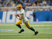 FILE - Green Bay Packers quarterback Aaron Rodgers scrambles during the first half of an NFL football game against the Detroit Lions, Nov. 6, 2022, in Detroit. Rodgers is leaving behind his brilliant legacy in Green Bay and heading to the bright lights -- and massive expectations -- of the Big Apple. The New York Jets agreed on a deal Monday, April 24, 2023, to acquire the four-time NFL MVP from the Packers, according to a person with knowledge of the trade. The person spoke to The Associated Press on the condition of anonymity because the teams have not officially announced the deal.