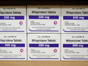 FILE - Boxes of the drug mifepristone sit on a shelf at the West Alabama Women's Center in Tuscaloosa, Ala., March 16, 2022.  An "anti-vice" law from the 19th century is at the center of a new court ruling that could soon halt access to the leading abortion drug in the U.S. On Friday, April 7, 2023, a Trump-appointed judge in Texas sided with Christian conservatives in ruling that the Comstock, enacted in the 1870s, prohibits sending the long-used drug through the mail. (AP Photo/Allen G.