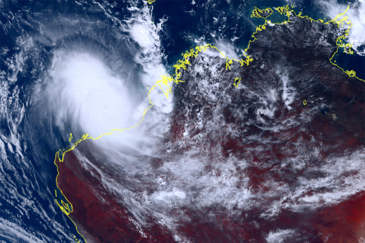 This satellite image taken by Himawari-8, a Japanese weather satellite, and provided by National Institute of Information and Communications Technology, shows cyclone Ilsa approaching  Australia's west coast, Thursday, April 13, 2023. A severe tropical cyclone lashed the northwest Australian coast with strengthening winds and increasing rain Thursday as authorities warned the population to prepare for destructive gusts of up to 275 kph (171 mph).