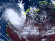 This satellite image taken by Himawari-8, a Japanese weather satellite, and provided by National Institute of Information and Communications Technology, shows cyclone Ilsa approaching  Australia's west coast, Thursday, April 13, 2023. A severe tropical cyclone lashed the northwest Australian coast with strengthening winds and increasing rain Thursday as authorities warned the population to prepare for destructive gusts of up to 275 kph (171 mph).