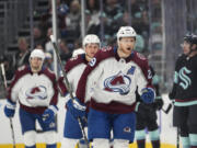 Colorado Avalanche center Nathan MacKinnon (29) reacts after scoring against the Seattle Kraken during the first period of Game 3 of an NHL hockey Stanley Cup first-round playoff series Saturday, April 22, 2023, in Seattle.