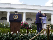 President Joe Biden hugs Rebecka Peterson, 2023 National Teacher of the Year, during a ceremony honoring the Council of Chief State School Officers' 2023 Teachers of the Year in the Rose Garden of the White House, Monday, April 24, 2023, in Washington.