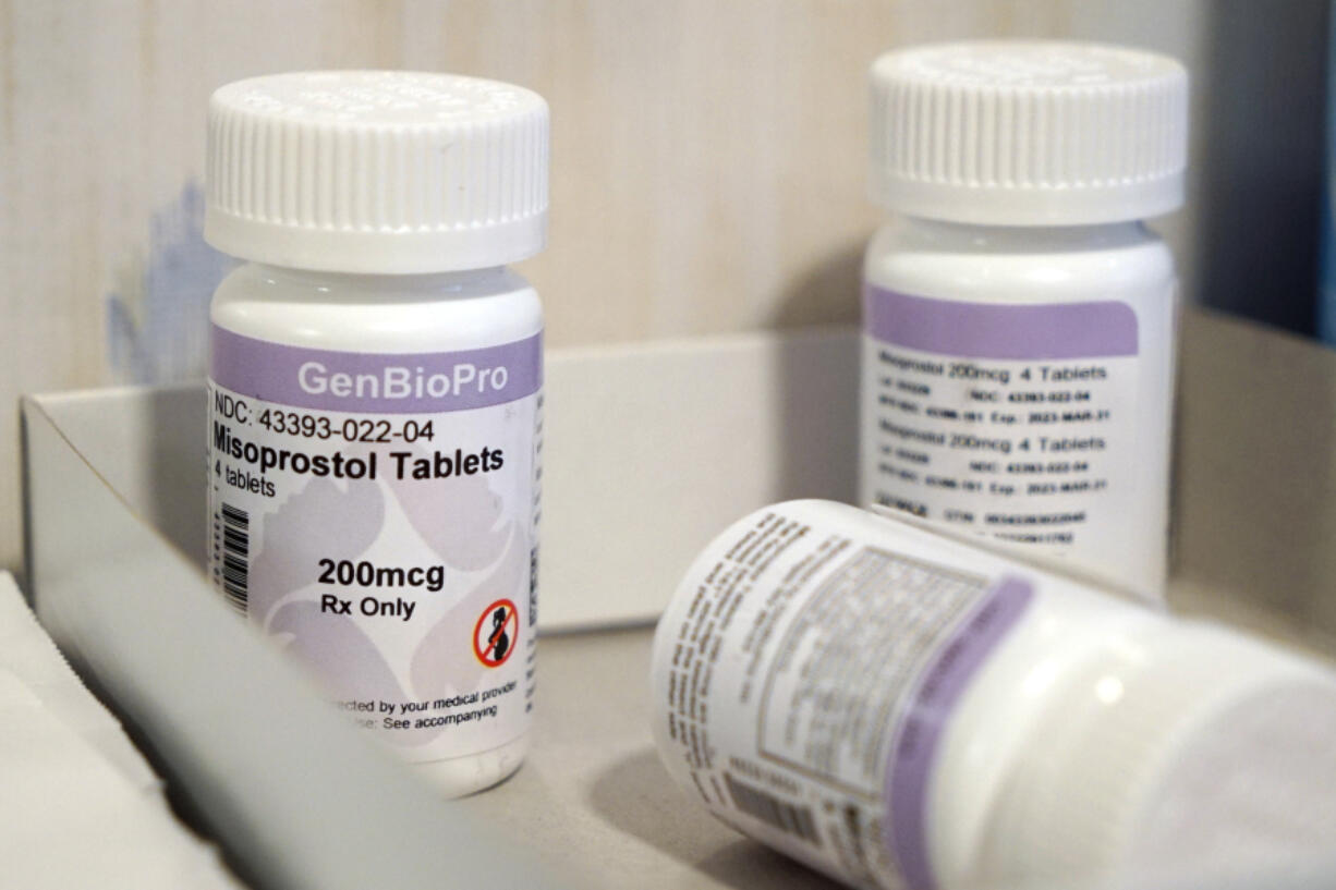 FILE - Bottles of the drug misoprostol sit on a table at the West Alabama Women's Center, March 15, 2022, in Tuscaloosa, Ala. White House officials warned on Wednesday, April 12, 2023, that access to nearly any medication is in jeopardy after a federal judge ordered that mifepristone, a pill commonly used for abortions, be pulled off the market, and they said they're consulting with lawmakers, doctors and pharmacies to fight the ruling. (AP Photo/Allen G.