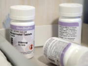 FILE - Bottles of the drug misoprostol sit on a table at the West Alabama Women's Center, March 15, 2022, in Tuscaloosa, Ala. White House officials warned on Wednesday, April 12, 2023, that access to nearly any medication is in jeopardy after a federal judge ordered that mifepristone, a pill commonly used for abortions, be pulled off the market, and they said they're consulting with lawmakers, doctors and pharmacies to fight the ruling. (AP Photo/Allen G.