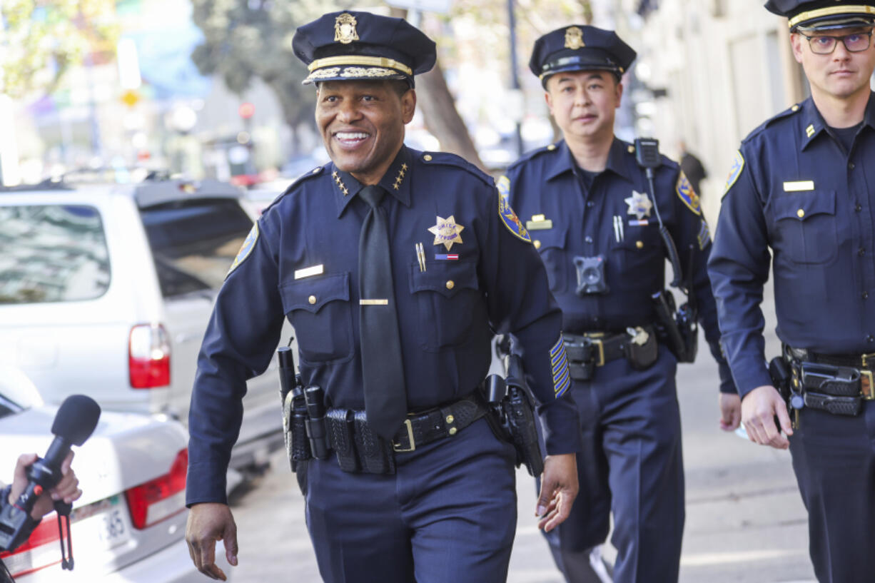 FILE - San Francisco Police Chief William Scott, left, takes a walk with police Capt. Chris Canning, right, March 16, 2022, in San Francisco, Calif. On Friday, April 14, 2023, and Saturday, April 15, Black police chiefs, commissioners, sheriffs and commanders from across the country are set to meet in Detroit for the annual CEO symposium of the National Organization of Black Law Enforcement Executives.