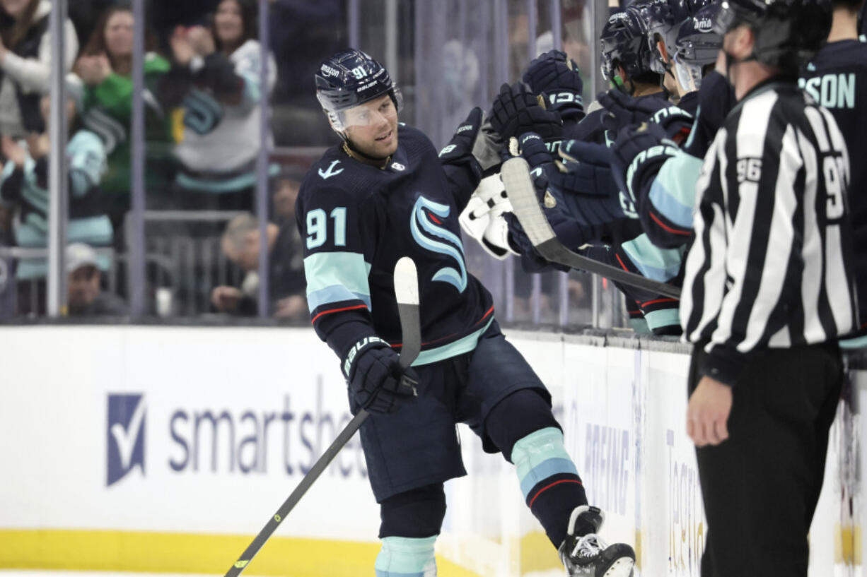 Seattle Kraken's Daniel Sprong (91) celebrates his goal against the Chicago Blackhawks during the second period of an NHL hockey game Saturday, April 8, 2023, in Seattle.