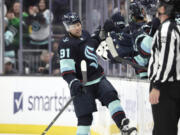 Seattle Kraken's Daniel Sprong (91) celebrates his goal against the Chicago Blackhawks during the second period of an NHL hockey game Saturday, April 8, 2023, in Seattle.
