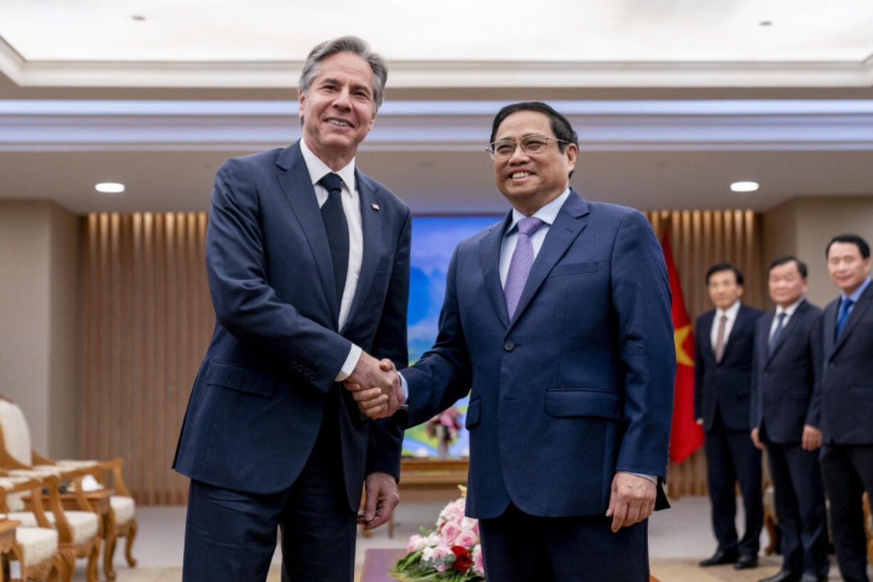 U.S. Secretary of State Antony Blinken, left, meets with Vietnamese Prime Minister Pham Minh Chinh at the Office of the Government in Hanoi, Vietnam, Saturday, April 15, 2023.