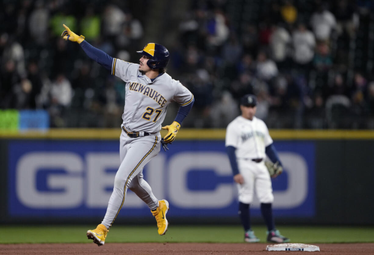 Milwaukee Brewers' Willy Adames gestures as he runs the bases after hitting a solo home run against the Seattle Mariners during the sixth inning of a baseball game Tuesday, April 18, 2023, in Seattle.