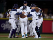 Seattle Mariners dance after the team's 5-4 win over the St. Louis Cardinals in a baseball game Saturday, April 22, 2023, in Seattle.