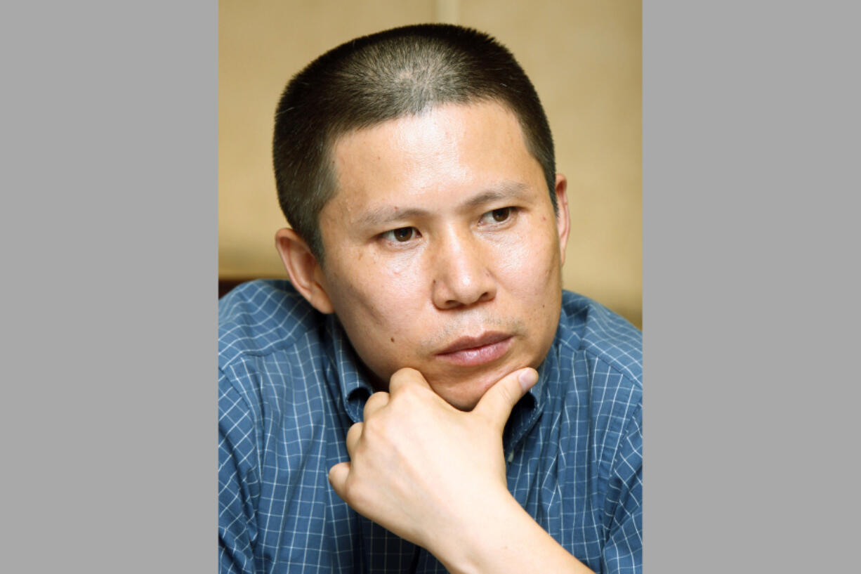 FILE - Legal scholar Xu Zhiyong is seen at a meeting in Beijing, China, on July 17, 2009. Xu and Ding Jiaxi, two prominent Chinese human rights lawyers, have been sentenced to more than a decade in prison, Human Rights Watch said Monday, April 10, 2023, the latest in a crackdown by the ruling Communist Party on its critics.