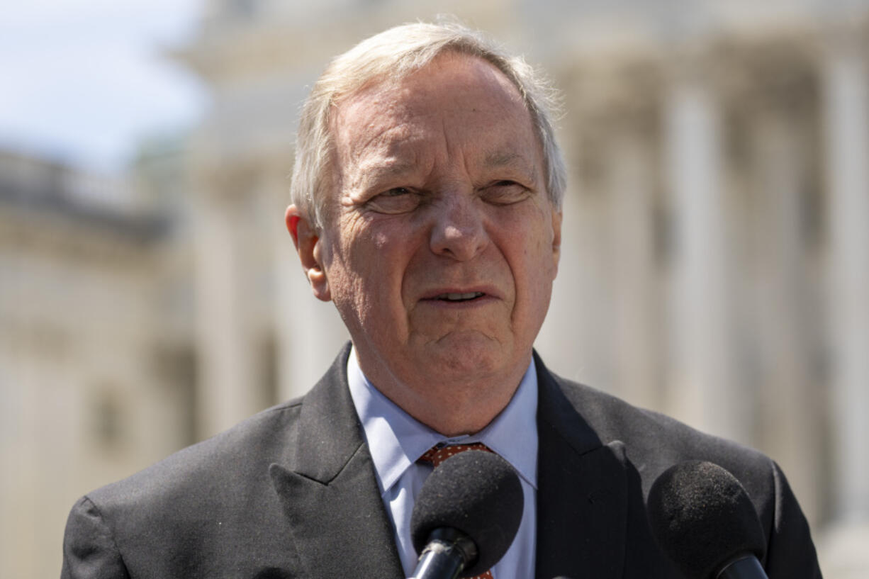 FILE - Sen. Dick Durbin, D-Ill., speaks with reporters about reproductive rights for U.S. veterans, on Capitol Hill, Wednesday, April 19, 2023, in Washington. Durbin, the Democratic chairman of the Senate Judiciary, has invited Supreme Court Justice John Roberts to testify next month at a hearing on ethics standards.