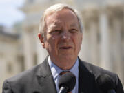 FILE - Sen. Dick Durbin, D-Ill., speaks with reporters about reproductive rights for U.S. veterans, on Capitol Hill, Wednesday, April 19, 2023, in Washington. Durbin, the Democratic chairman of the Senate Judiciary, has invited Supreme Court Justice John Roberts to testify next month at a hearing on ethics standards.