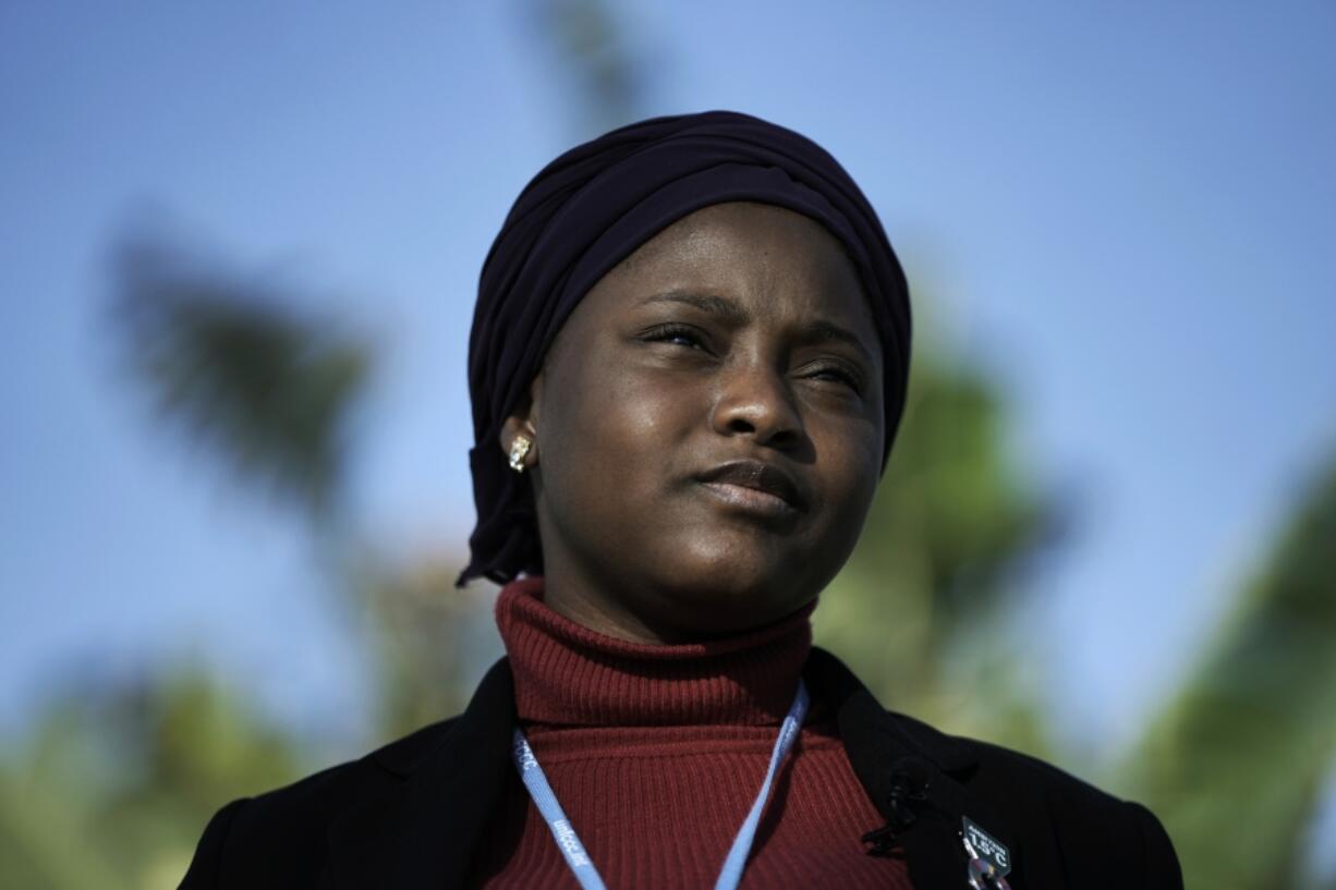 FILE - Nakeeyat Dramani Sam, of Ghana, poses for photos at the COP27 U.N. Climate Summit, Friday, Nov. 18, 2022, in Sharm el-Sheikh. Now 11, Sam is critical of the older generation, saying that "when they had all the power and authority, they didn't do much to stop global warming," but "at least some of them have listened," she says.