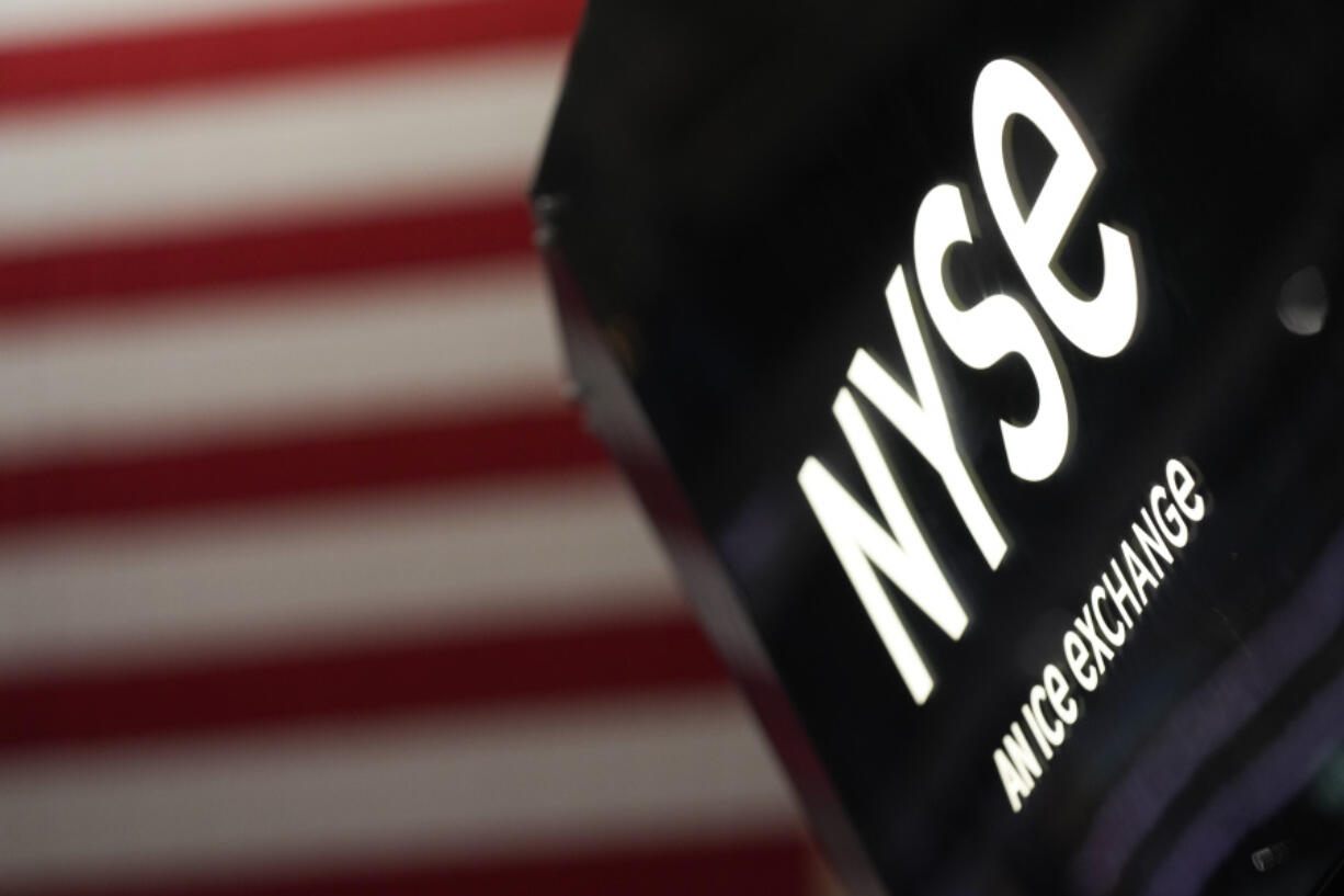 FILE - An NYSE sign is seen on the floor at the New York Stock Exchange in New York, Wednesday, Feb. 22, 2023.