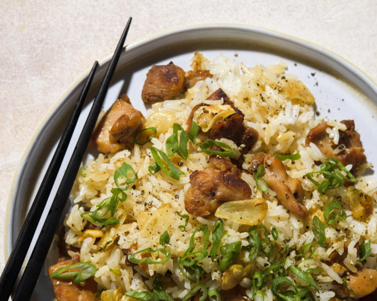 This image released by Milk Street shows a recipe for Garlic Fried Rice w/Chicken.