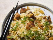 This image released by Milk Street shows a recipe for Garlic Fried Rice w/Chicken.