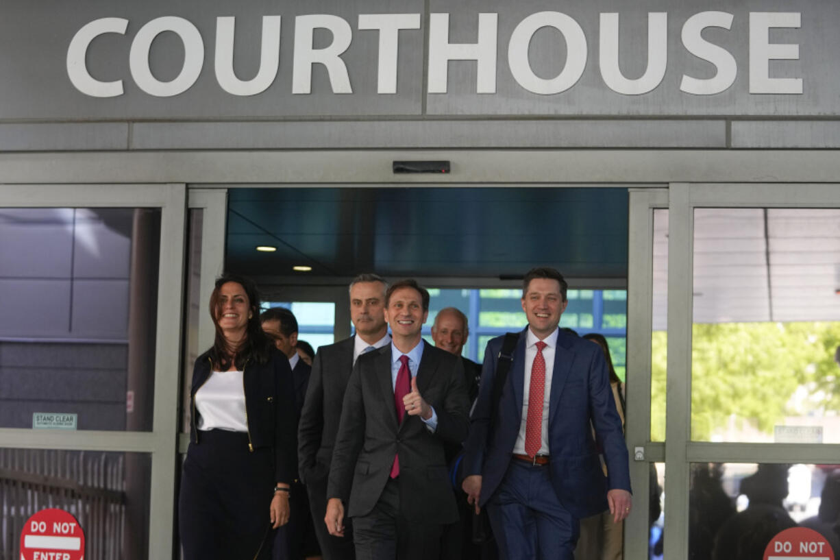 Dominion Voting Systems' legal team exits the New Castle County Courthouse in Wilmington, Del., after the defamation lawsuit against Fox News was settled Tuesday.