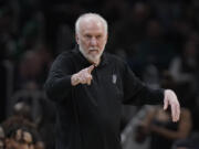 FILE - San Antonio Spurs head coach Gregg Popovich points from the bench in the second half of an NBA basketball game against the Boston Celtics, Sunday, March 26, 2023, in Boston. The Naismith Memorial Basketball Hall of Fame made it all official on Saturday, April 1, 2023 with three of the NBA's all-time international greats -- Dirk Nowitzki, Tony Parker and Pau Gasol -- joining Dwyane Wade, Becky Hammon and  Popovich as the headliners of the 2023 class that will be enshrined on Aug.