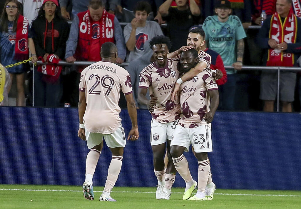 Portland Timbers' Yimmi Chara (23) is congratulated for his goal against St. Louis City during the second half of an MLS soccer match Saturday, April 29, 2023, in St. Louis.