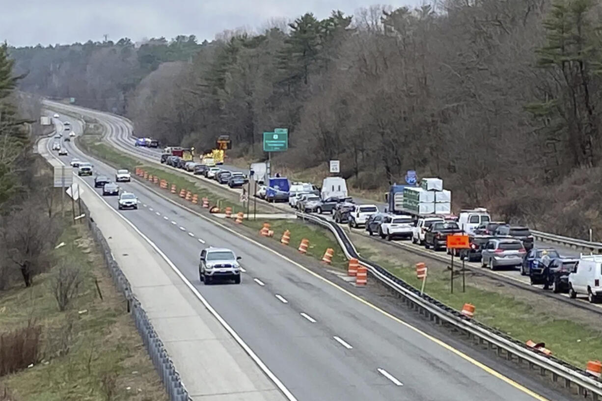 In a still frame from video provided by WGME-TV traffic is backed up near a scene where people were injured in a shooting on Interstate 295, in Yarmouth, Maine, Tuesday, April 18, 2023. Gunfire that erupted on the busy highway is linked to a second crime scene where several people have been found dead in a home about 25 miles away in the town of Bowdoin, Maine, state police said Tuesday.