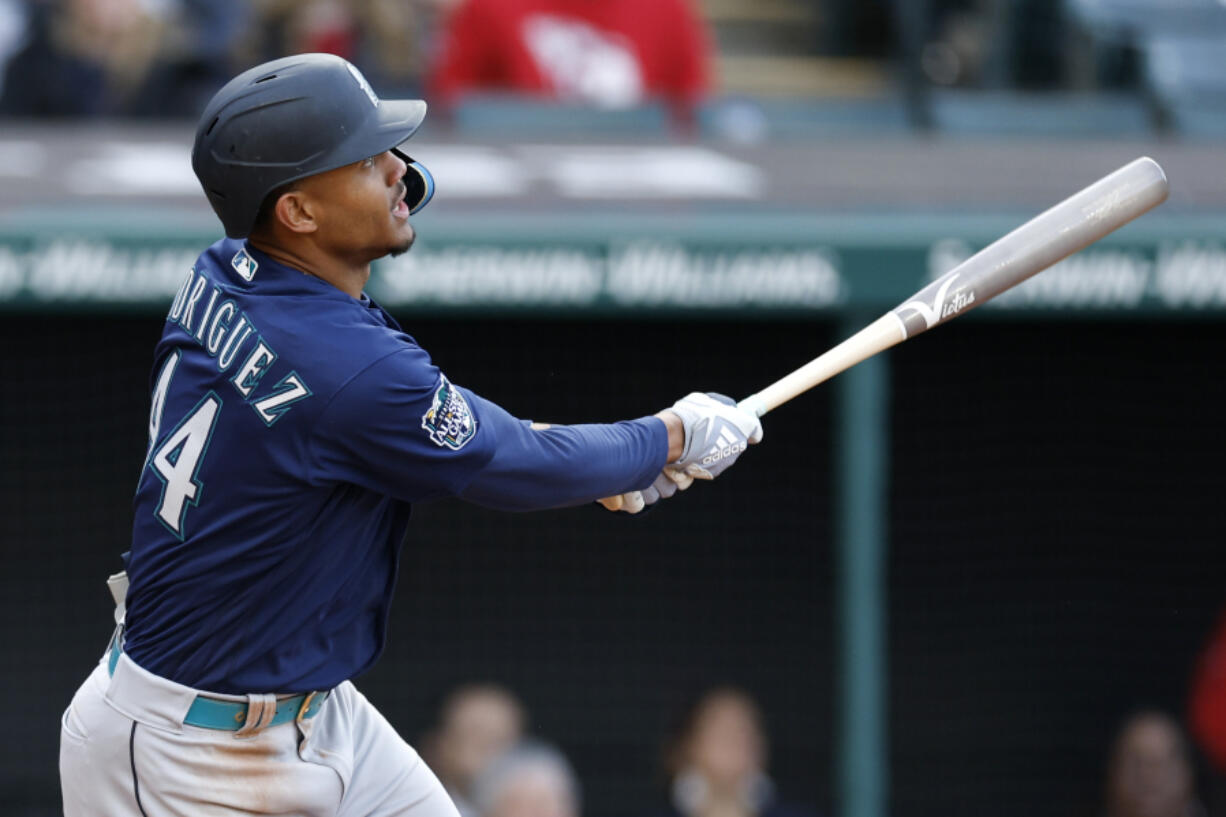 Seattle Mariners' Julio Rodriguez watches his two-run home run off Cleveland Guardians relief pitcher Nick Sandlin during the sixth inning of a baseball game Friday, April 7, 2023, in Cleveland.