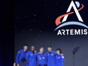 NASA Administrator Bill Nelson, center, joins astronauts, from left, Jeremy Hansen, Victor Glover, Reid Wiseman and Christina Hammock Koch, as they are announced as the Artemis II crew during a NASA ceremony naming the four astronauts who will fly around the moon by the end of next year, at a ceremony held in the NASA hanger at Ellington airport Monday, April 3, 2023, in Houston.