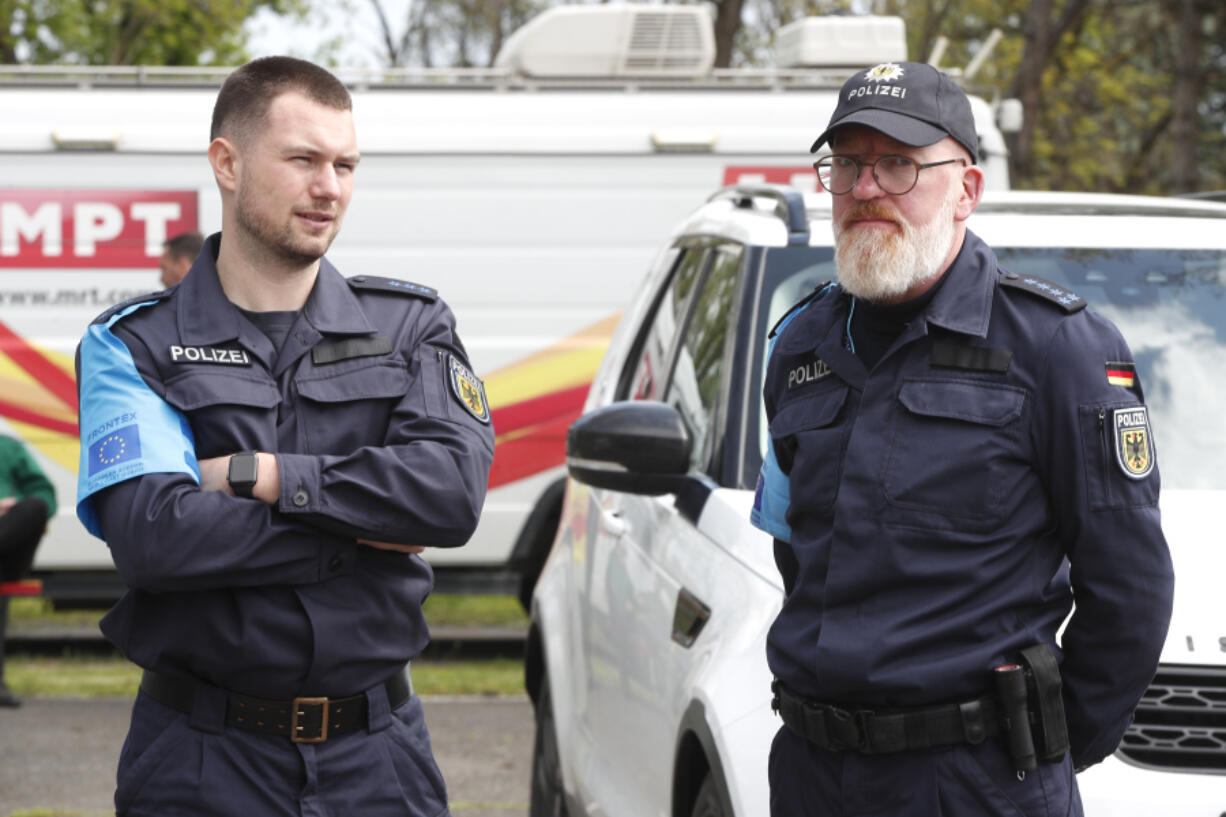 German members of Frontex Standing Corps talk to each other prior the official launch of the Frontex Joint Operation in North Macedonia, at police barracks in Skopje, North Macedonia, on Thursday, April 20. 2023.