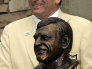 FILE -Former San Francisco 49ers great Dave Wilcox poses with his bust after enshrinement into the Pro Football Hall of Fame Saturday, July 29, 2000, in Canton, Ohio. Hall of Fame linebacker Dave Wilcox, who made the Pro Bowl seven times in his 11 seasons with the San Francisco 49ers, has died. He was 80. The Pro Football Hall of Fame said Wilcox, who is also the father of California football coach Justin Wilcox, died on Wednesday, April 19, 2023.