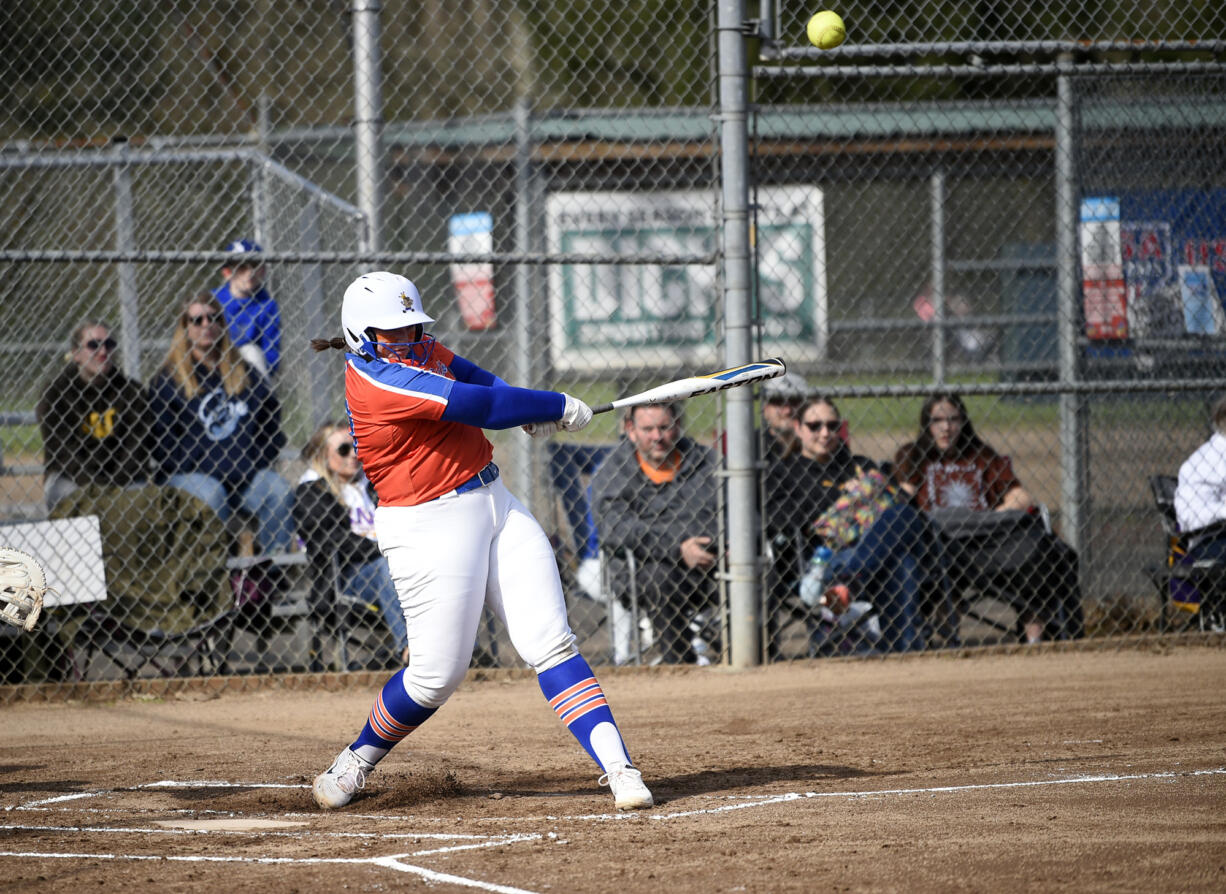 Ridgefield’s Maizy Whitlow connects on a single to right field during Ridgefield’s 19-6 win over Columbia River in a 2A Greater St. Helens League softball game at VGSA on Thursday, April 13, 2023.