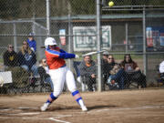 Ridgefield’s Maizy Whitlow connects on a single to right field during Ridgefield’s 19-6 win over Columbia River in a 2A Greater St. Helens League softball game at VGSA on Thursday, April 13, 2023.