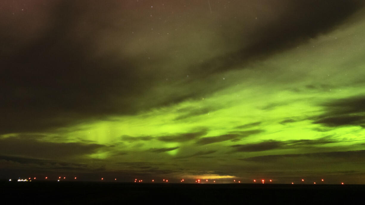 An aurora borealis, also known as the northern lights, is seen in the night sky in the early morning hours of Monday, April 24, 2023, near Washtucna, Wash. (AP Photo/Ted S.