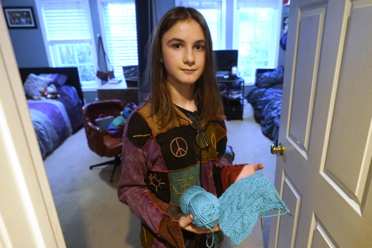 Elle Palmer, 13, poses for a photograph, Monday, Feb. 7, 2023, in Salt Lake City. Elle came out as a transgender girl in fifth grade. Now in seventh, she planned to start hormone treatment this summer so potential side effects wouldn't interfere with her life during the school year, especially her team's extracurricular math competitions.