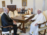 In this picture made available by Vatican Media Ukraine Prime Minister Denys Shmyhal, left, meets with Pope Francis at The Vatican, Thursday, April 27, 2023.