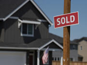 A sign outside a new home in Ridgefield in 2021 lets homebuyers know the property's status.