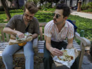 Architects Thomas Keller and Henri Brooks (right) eat tacos from El Fuego in Washington Square Park. "I eat Mexican twice a week," Keller said. (Alejandro A.