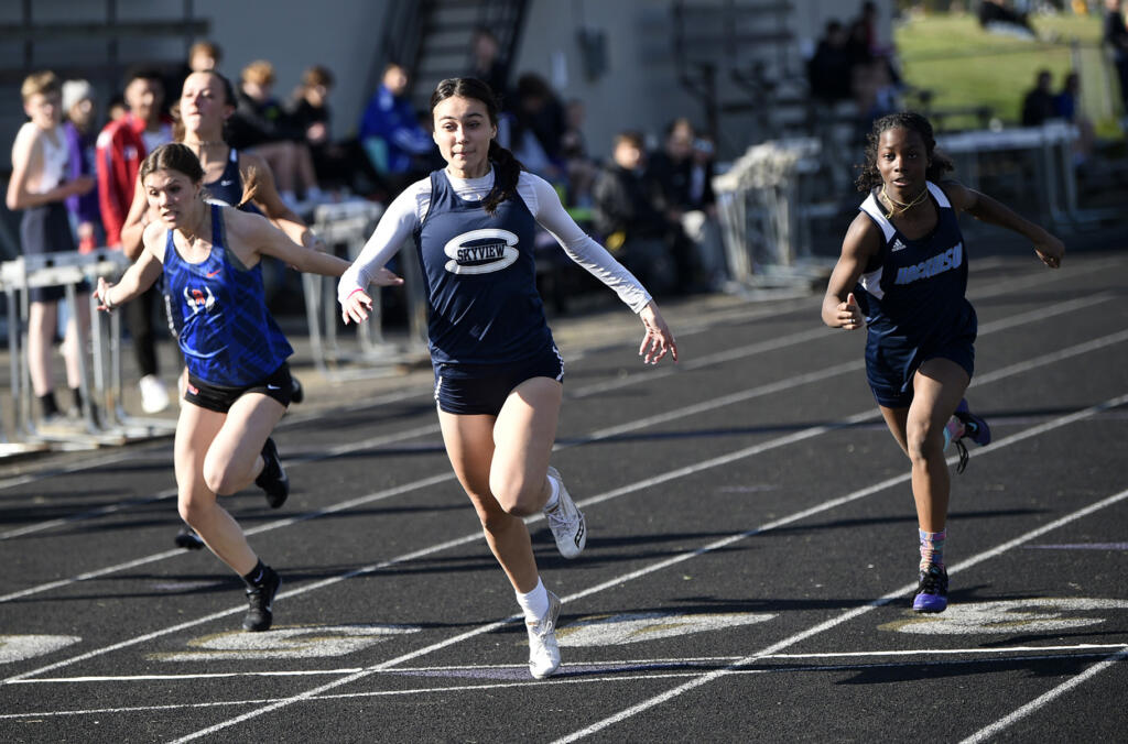 Skyview’s Dea Covarrubias (center), shown here running the 100 meters at the John Ingram Twilight Invitational track and field meet in April, won the District 4 4A 100 meters on Wednesday at McKenzie Stadium.