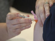 A nurse administers a flu shot at Legacy Salmon Creek .