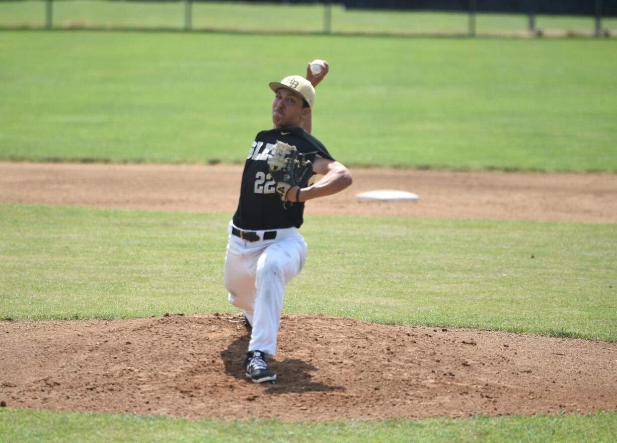 Hudson’s Bay starting pitcher Chanz Flores delivers a pitch in the first inning of a Class 2A first round state playoff game against White River on Saturday at W.F. West High School in Chehalis.