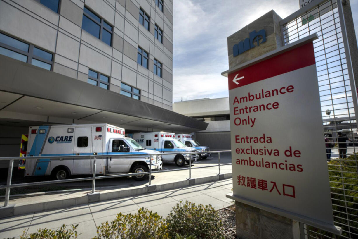 Ambulances deliver patients to Methodist Hospital in Arcadia. The hospital said it met the criteria for crisis care mode as it is now caring for 233 patients, more than half for COVID positive in isolation. Photographed at Arcadia on Wednesday, Jan. 6, 2021, in Arcadia, California. (Myung J.