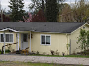 A home in La Center, which previously featured swastikas and a Nazi flag, is pictured without either Tuesday morning.