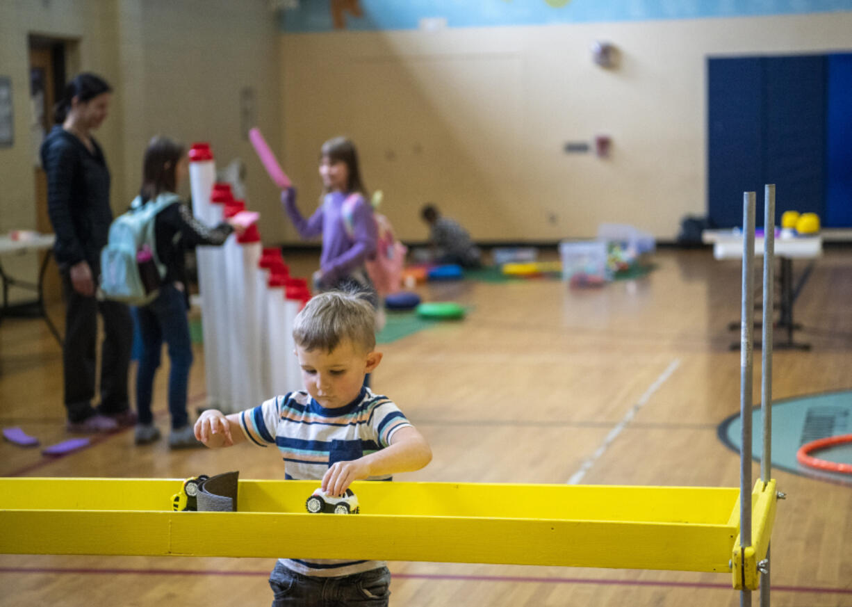 Flint Reed, 3, plays with toy cars Tuesday during a Play Project event at the Boys and Girls Clubs of Southwest Washington Gloria and Clinton John Clubhouse. Columbia Play Project and Boys and Girls Clubs are hosting a Play Project fundraiser as part of GiveBIG, a statewide nonprofit fundraising event.