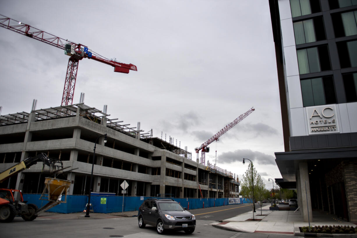 Construction continues at the future location for ZoomInfo, left, at the Port of Vancouver's Terminal 1. ZoomInfo plans to relocate when the project is completed in 2025.